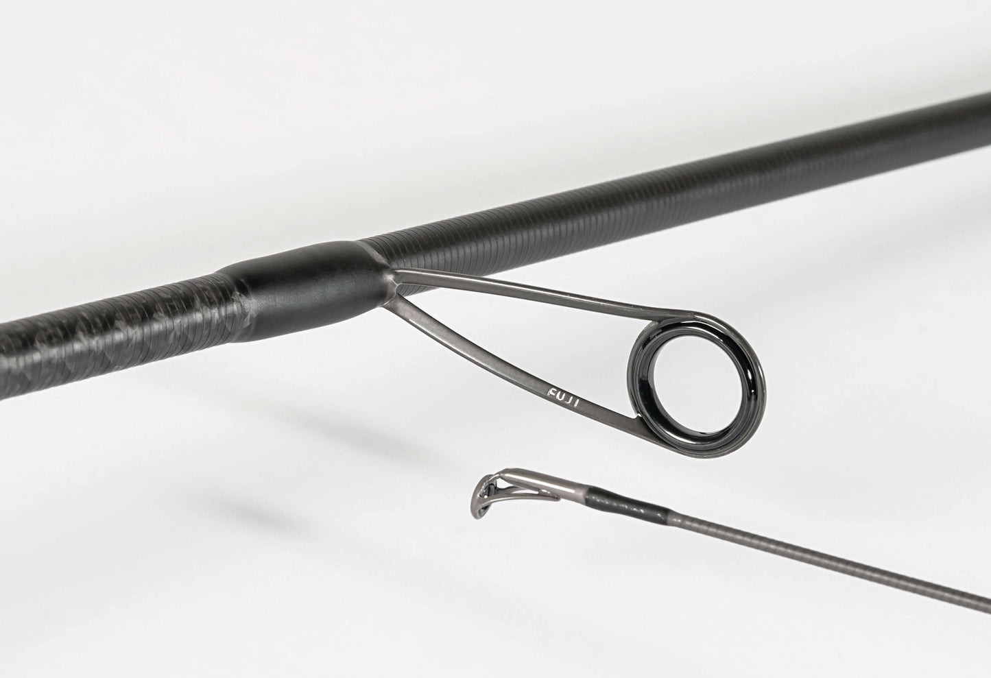  Rapture Black Cross spinning rod showcasing High Modulus Carbon design and Fast/Extra Fast action.
