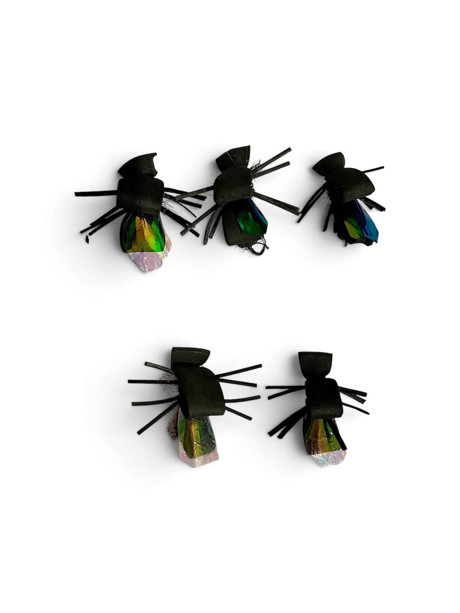 Burdock artificial flies in various sizes, designed for fly fishing, featuring black foam bodies.