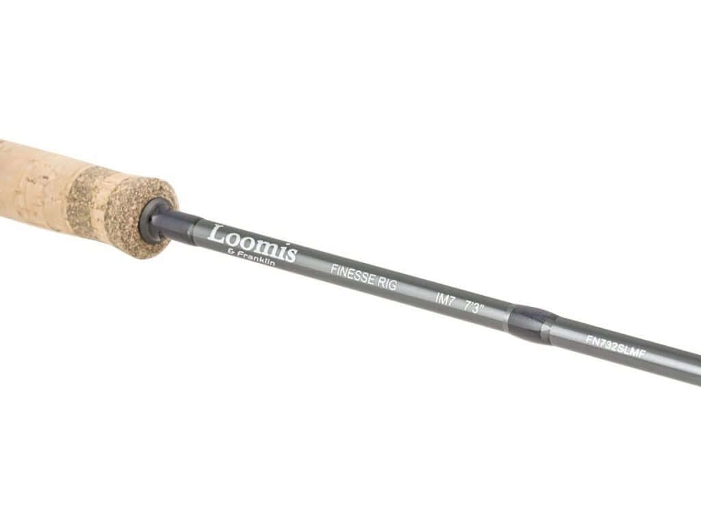 Loomis & Franklin Finesse Rig IM7 spinning rod detail with cork handle and branded logo.